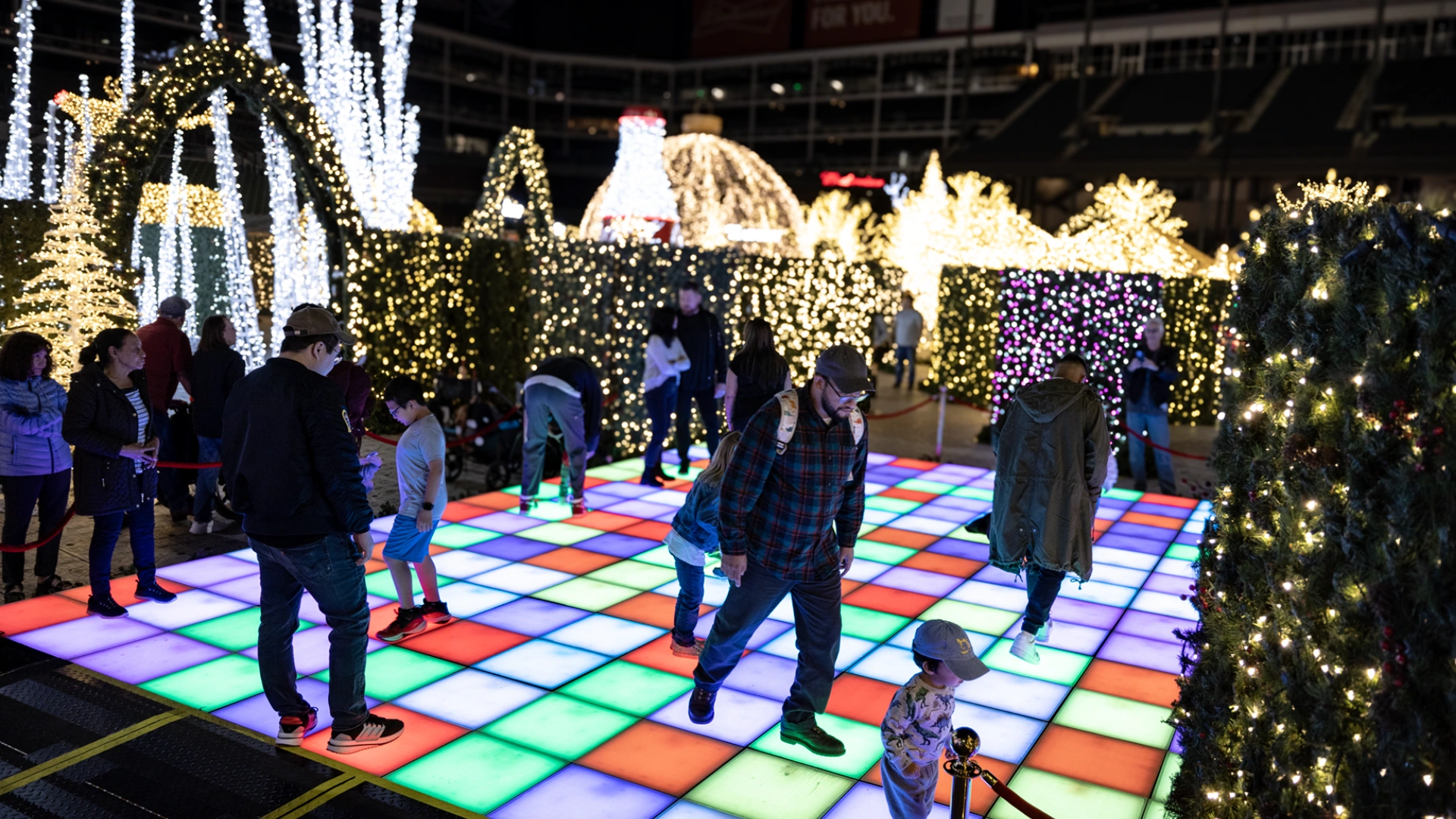 Families and friends enjoying live music and dancing under the stars
